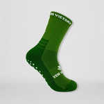 Fussballsocken in grün mit rutschfesten Gumminoppen in Kreuzform für besseren Halt in allen Sportarten.