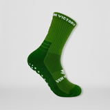 Fussballsocken in grün mit rutschfesten Gumminoppen in Kreuzform für besseren Halt in allen Sportarten.
